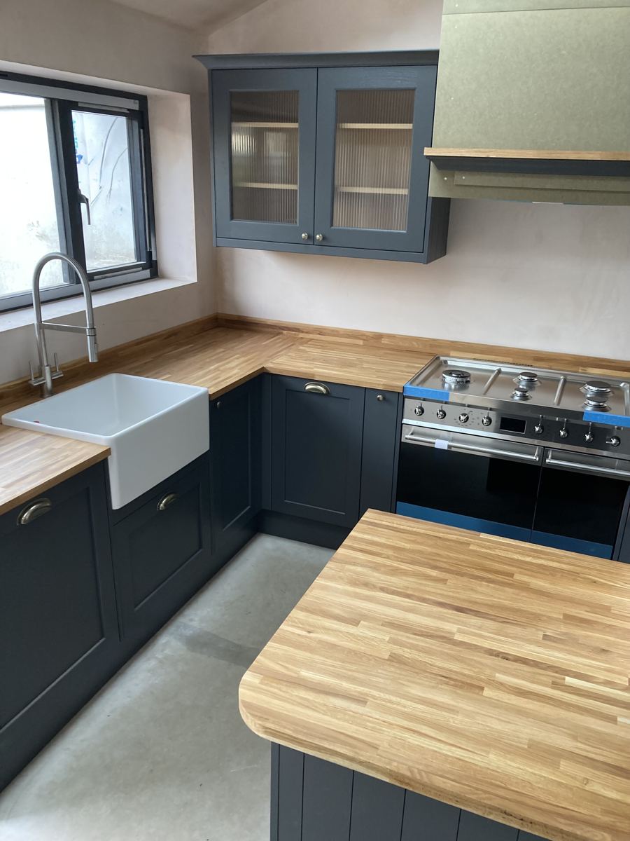 Black shaker kitchen with oak worktops and belfast sink, Cardiff