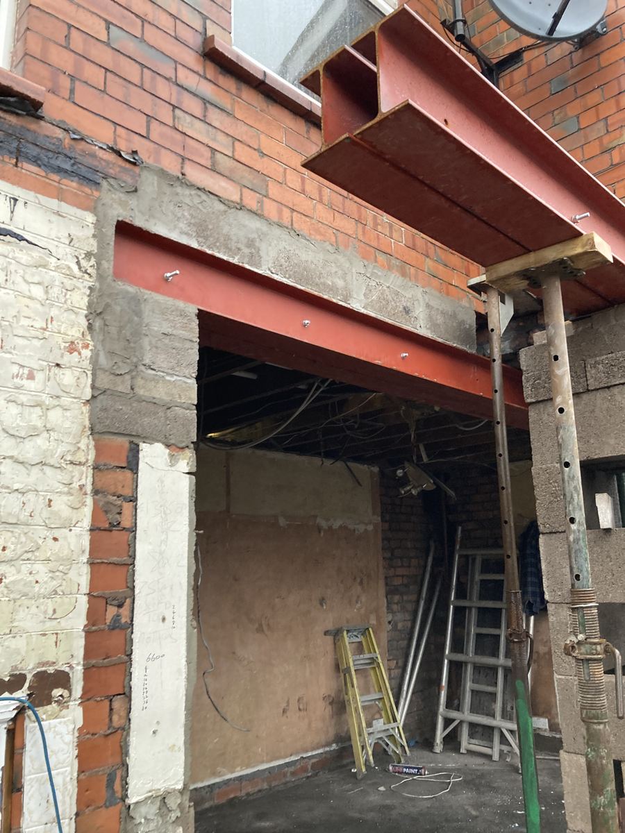 Structural steel beams installed to open up the ground floor