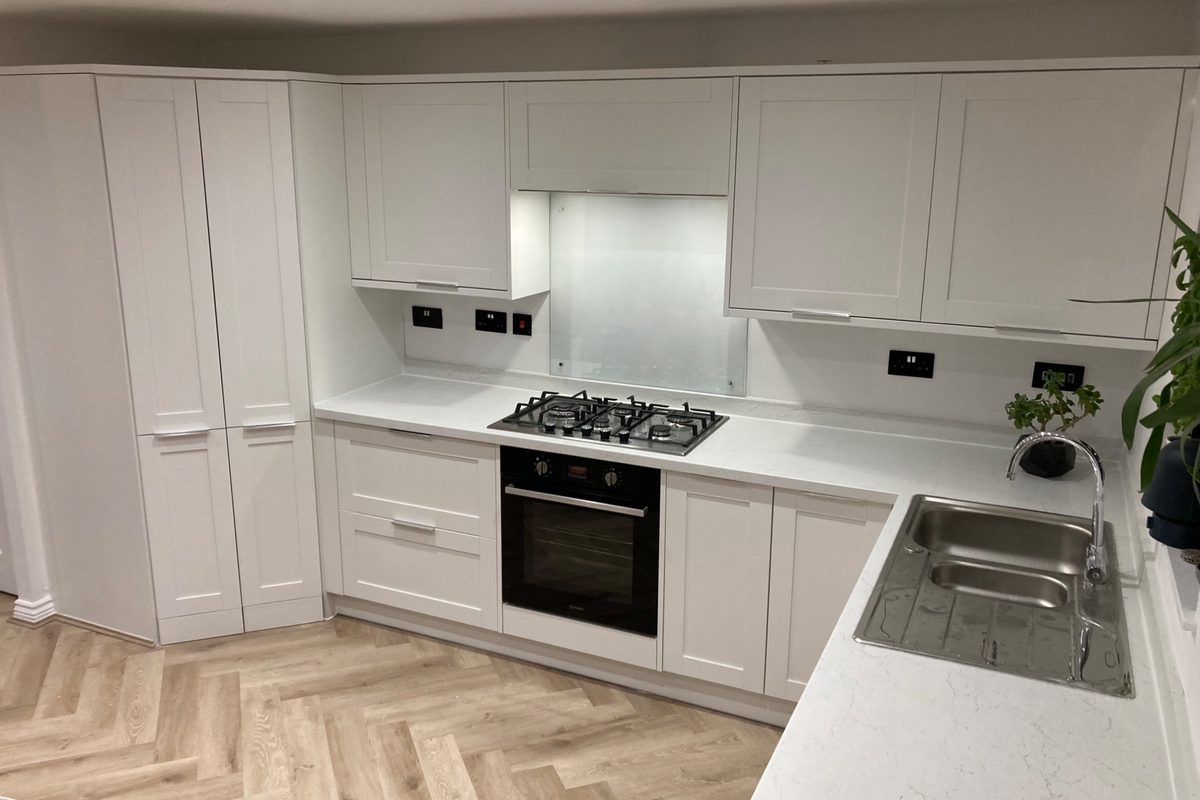 White shaker kitchen with quartz worktop — Fitted Homes Cardiff