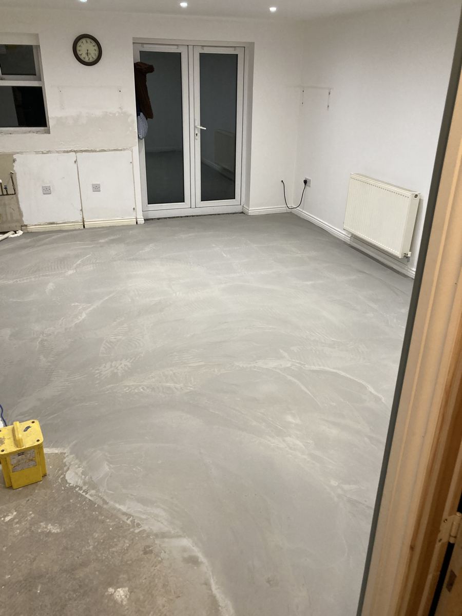 Old floor tiles removed and the floor levelled ready for new flooring